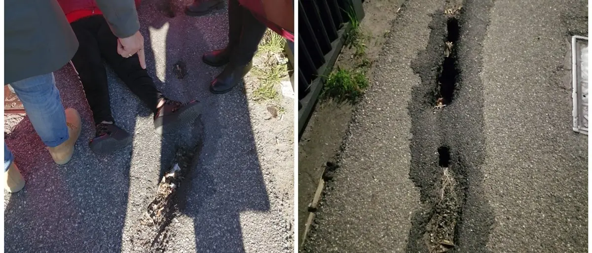 Anziana cade a terra a causa di una buca e rischia di essere travolta da un’auto in transito