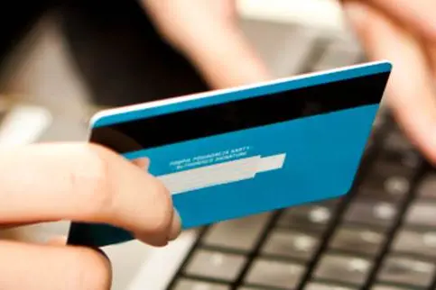 Online shopping with credit card on laptop , Getty Images/iStockphoto