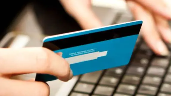 Online shopping with credit card on laptop , Getty Images/iStockphoto