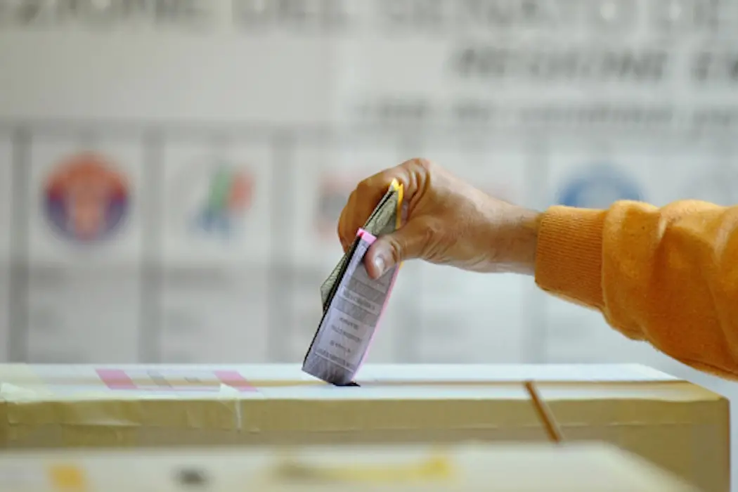 Italy\\'s voter casts their ballots at a polling station in Bologna on April 13, 2008. Italians began voting in general elections likely to usher conservative Silvio Berlusconi into the prime minister\\'s office for a third time at the expense of new centre-left flagbearer Walter Veltroni. AFP PHOTO / Vincenzo Pinto (Photo credit should read VINCENZO PINTO/AFP/Getty Images) , AFP/Getty Images