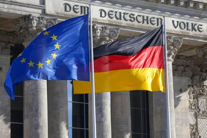 epa11915566 The European and German flags are seen in front of the Reichstag building in Berlin, Germany, 22 February 2025. Germany will hold early federal elections on 23 February 2025, to elect a new Bundestag (parliament). EPA/CHRISTOPHER NEUNDORF , EPA