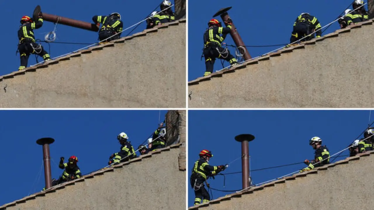 Vigili del fuoco al lavoro per montare il comignolo sulla Sistina (Ansa)