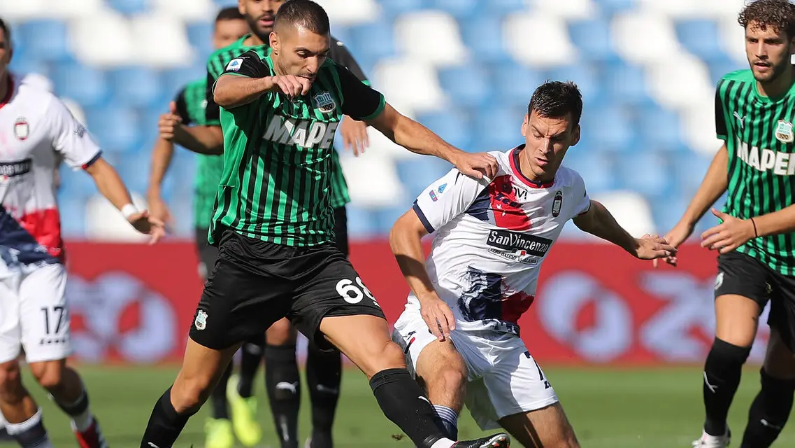REGGIO NELL\\'EMILIA, ITALY - OCTOBER 03: Mehdi Bourabia of US Sassuolo battles for the ball with Milos Vulic of FC Crotone during the Serie A match between US Sassuolo and FC Crotone at Mapei Stadium - Citt\\u00C3\\u0192\\u00C2 del Tricolore on October 3, 2020 in Reggio nell\\'Emilia, Italy (Photo by Gabriele Maltinti/Getty Images) , Getty Images
