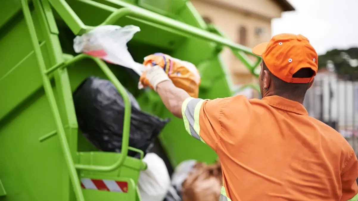 Cropped shot of a garbage collection worker , Getty Images/iStockphoto