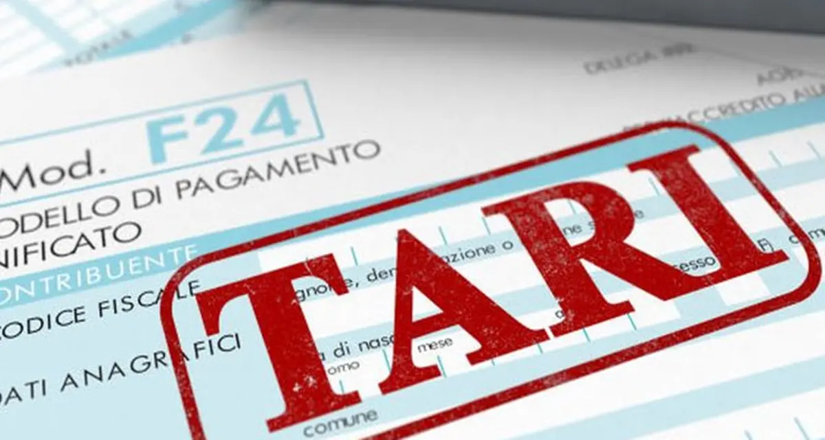 close up view of F24 form for italian taxes,the word tari and an electronic calculator (3d render)