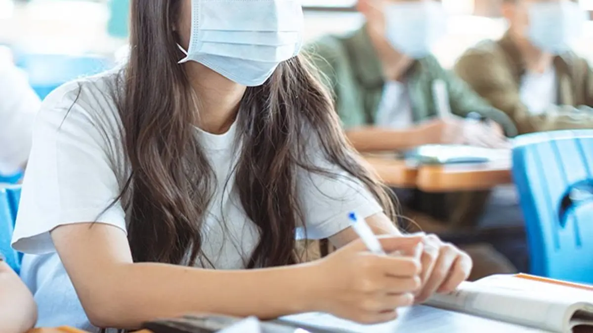Students wearing protection mask to prevent germ, virus and PM 2.5 micron in classroom , Getty Images/iStockphoto