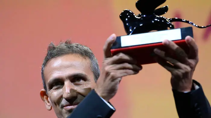 Italian director Michelangelo Frammartino acknowledges receiving the Special Jury Prize for \"Il Buco\" (The Hole) during the closing ceremony of the 78th Venice Film Festival on September 11, 2021 at Venice Lido. ANSA/CLAUDIO ONORATI , ANSA