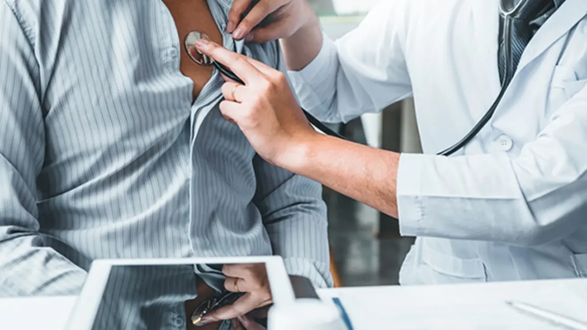 Doctor Measuring arterial blood pressure man patient Health care in hospital , Getty Images/iStockphoto