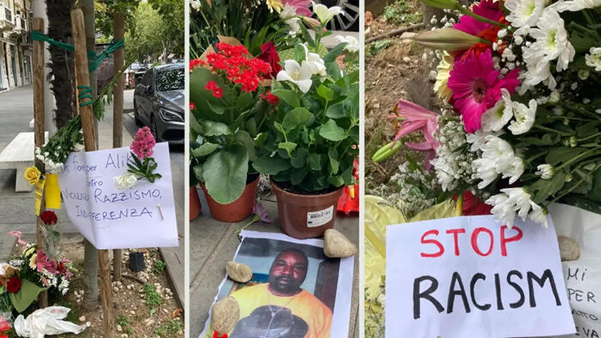Fiori e biglietti deposti sul luogo dove ieri ? stato aggredito e ucciso l\\'\\'ambulante nigeriano Alika Ogorchukwuch, ucciso dal 32enne italiano Filippo Claudio Giuseppe Ferlazzo, Civitanova Marche, 30 luglio 2022 ANSA , ANSA