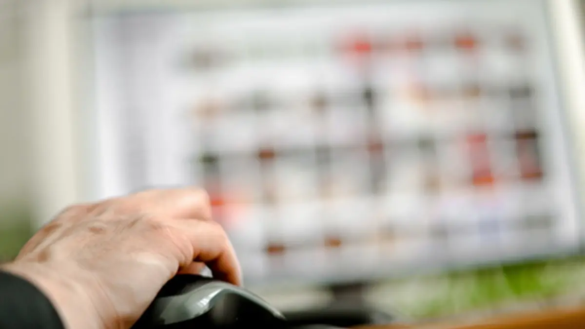 epa08473194 A person sits in front of a computer screen showing many small photos and holds a computer mouse in his hand, in Duisburg, Germany, 08 June 2020. According to the investigators, the case of child sex abuse ring in Muenster, with three victims and eleven suspects, seven of whom are in custody, is characterized by its highly professional technical equipment for video recording and data encryption. Abuse offenders adapt to the possibilities, but also to the dangers of detection and professionalize themselves on the net, according to police investigators. In 2019 there were more than 12,000 investigations and criminal proceedings in Germany for so-called child pornography. EPA/SASCHA STEINBACH , EPA