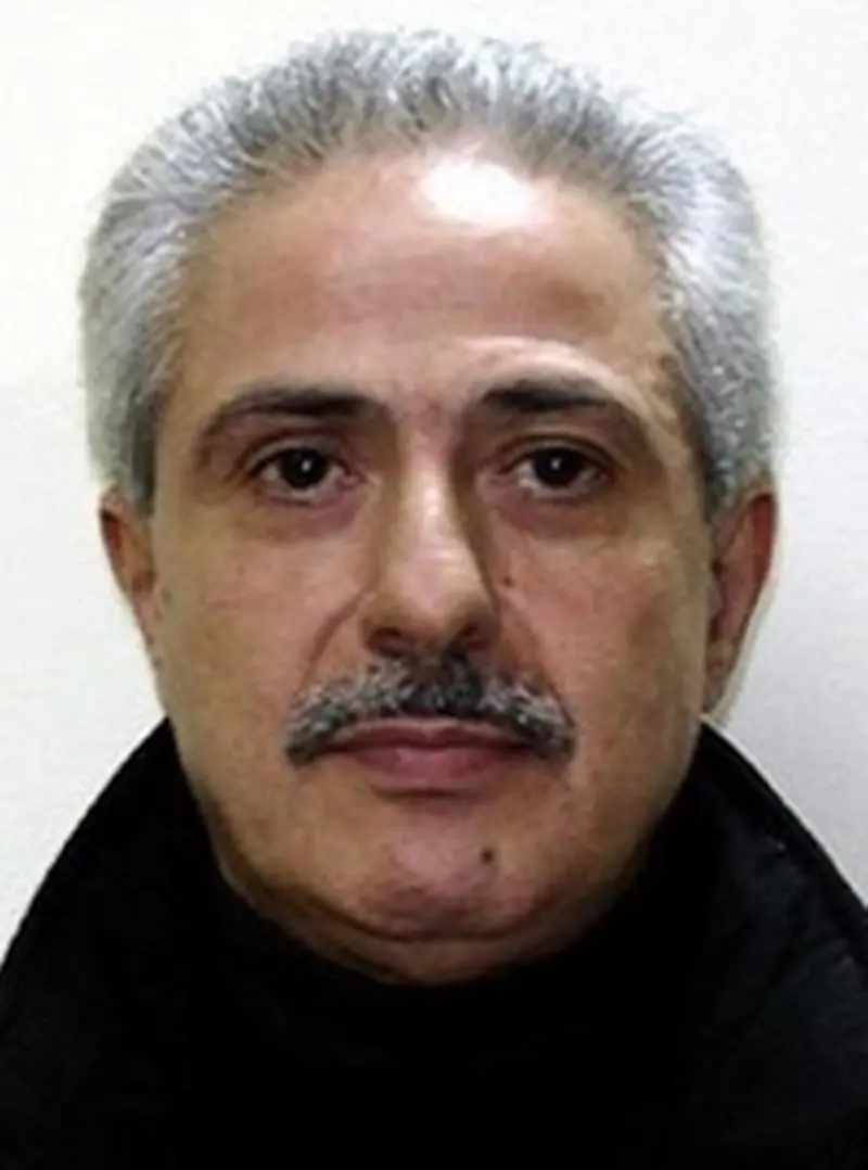 Picture made available by Italian Police Tuesday, Feb. 19, 2008, showing Pasquale Condello a top boss of the powerful 'ndrangheta organized crime syndicate, captured in Reggio Calabria, southern Italy, Monday night. Now 57-years old, Condello, whose clan feuds have bloodied the southern region for years, was fugitive for 20 years. Condello was known as \\\"the supreme one'' for his role at the top of the crime syndicate. (AP Photo/Italian Police, ho)
