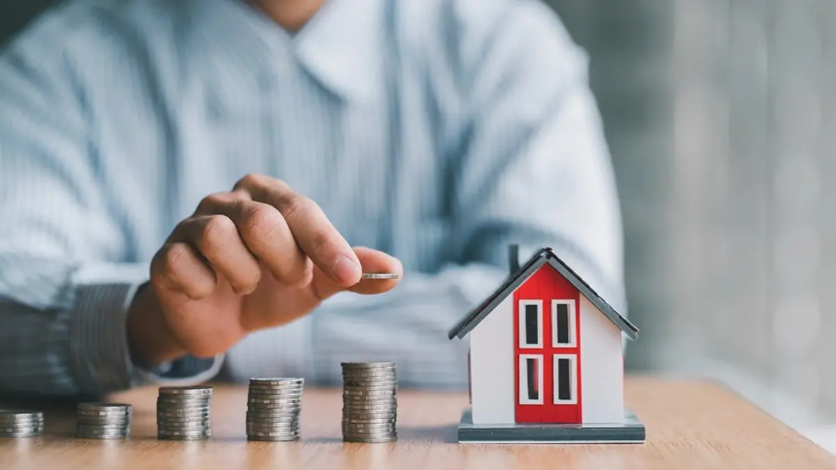 stack of money and home models, home insurance ideas and insurance agents for those interested. , PaeGAG - stock.adobe.com