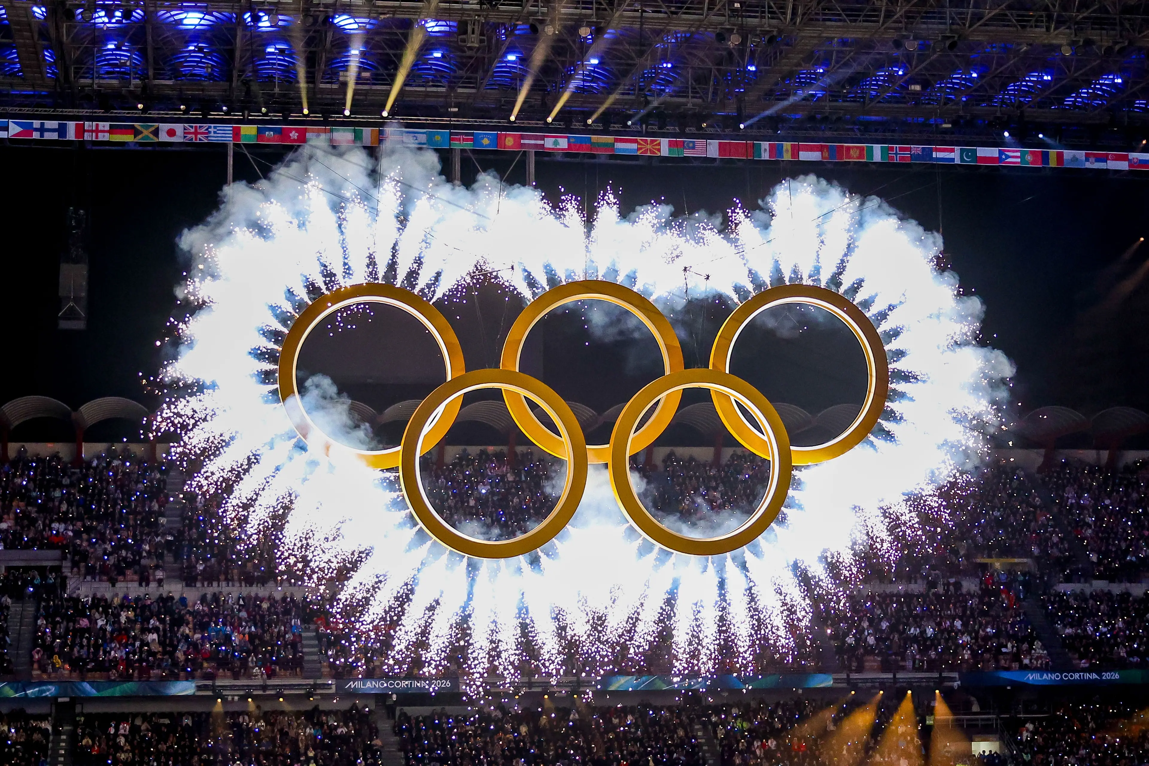 The five Olympic rings enter during the Opening Ceremony of the Olympic Winter Games Milano-Cortina 2026 on February 06, 2026 at the Milano San Siro Olympic Stadium in Milan, Italy