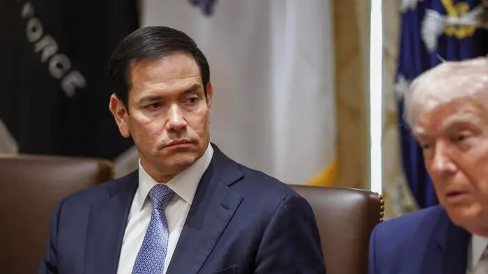epa12851251 US Secretary of State Marco Rubio (L) looks on as US President Donald J. Trump delivers remarks during a cabinet meeting in the Cabinet Room of the White House in Washington, DC, USA, 26 March 2026. EPA/WILL OLIVER / POOL , EPA