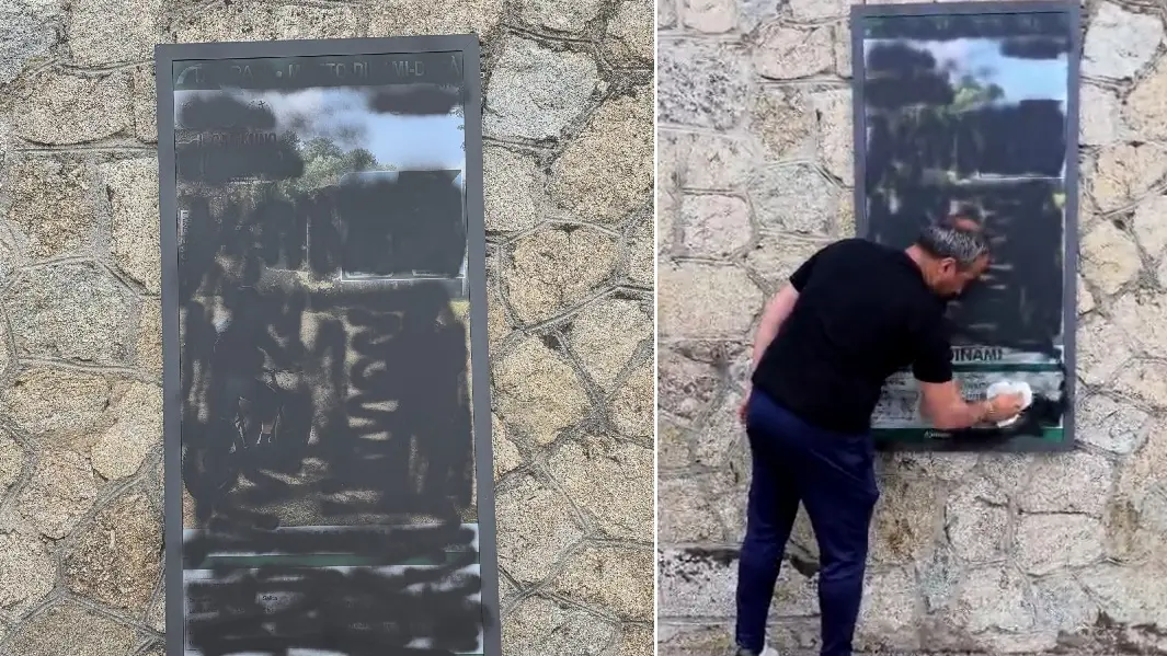 <p>Il cartello vandalizzato a Dinami poi ripulito dal sindaco</p>\\n