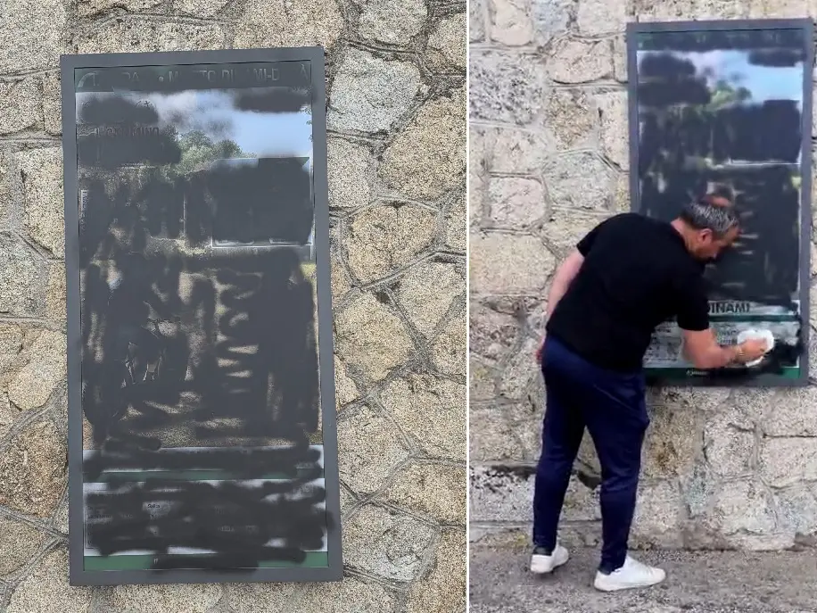 A Dinami vandalizzato il cartello del Cammino del Normanno, il sindaco lo ripulisce: «Colpita l’intera comunità»