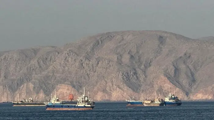 TOPSHOT - Vessels are seen anchored in the Strait of Hormuz, off the port city of Khasab on Oman\\'s northern Musandam Peninsula on May 17, 2026. Washington, locked in conflict with Tehran since US and Israeli forces launched major strikes on the Islamic republic beginning February 28, has struggled to break an impasse and make any progress toward ending a war that has shaken the Middle East and sent energy prices climbing. The war has led to an effective blockade of the critical Strait of Hormuz, through which some 20 percent of global oil exports pass in peacetime, and has drawn neighbors Israel and Lebanon into a deadly side conflict. (Photo by AFP) / , AFP
