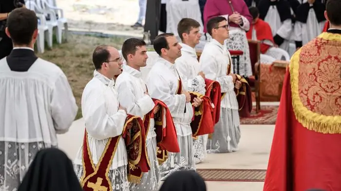 New priests takes part in an ordination ceremony of the traditionalist Catholic Society of Saint Pius X (SSPX), in Econe, near Sion, western Switzerland, on June 29, 2026. Defying Vatican, Society of Saint Pius X will ordain its own bishops on July 1, 2026, despite the risk of being considered schismatic. (Photo by Fabrice COFFRINI / AFP) , AFP